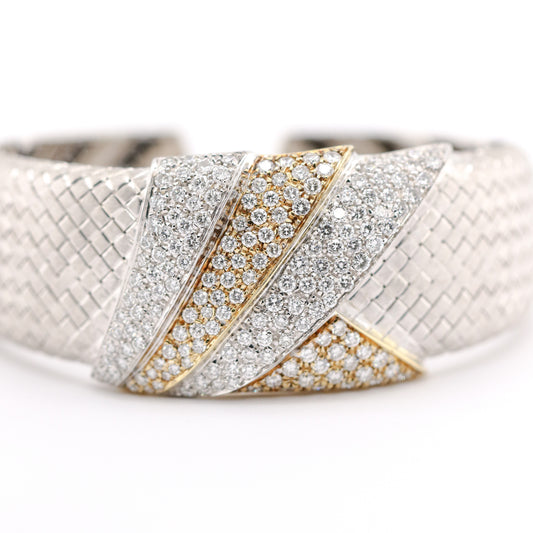 Luxury bracelet with diamond accents on a white background