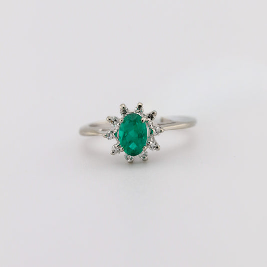white gold ring with emerald and diamonds in spokane