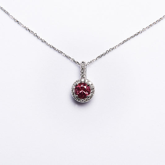 rare spinel gemstone necklace ringed with diamonds.